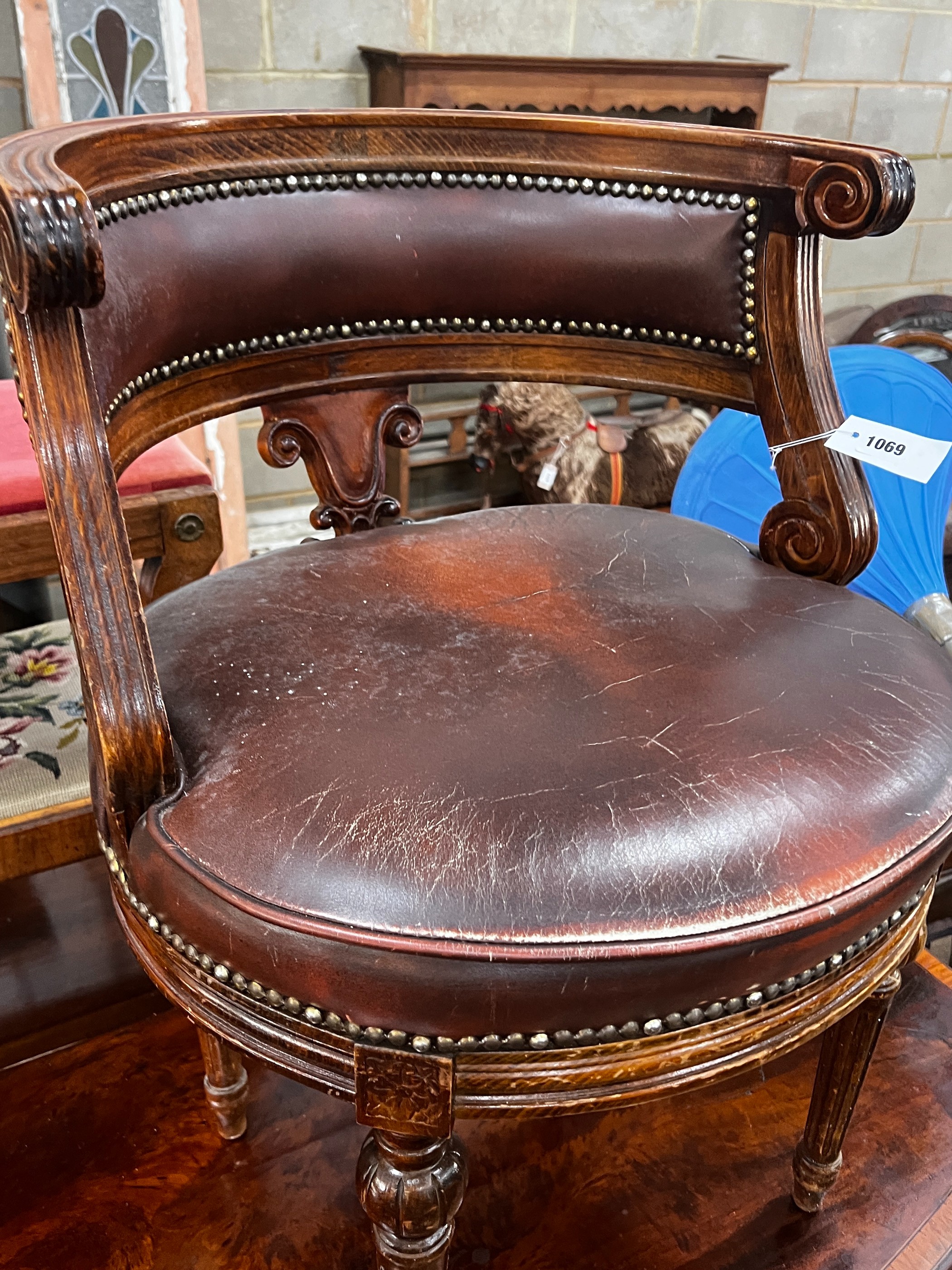 A Continental beech desk chair with leather seat, width 53cm, depth 48cm, height 73cm